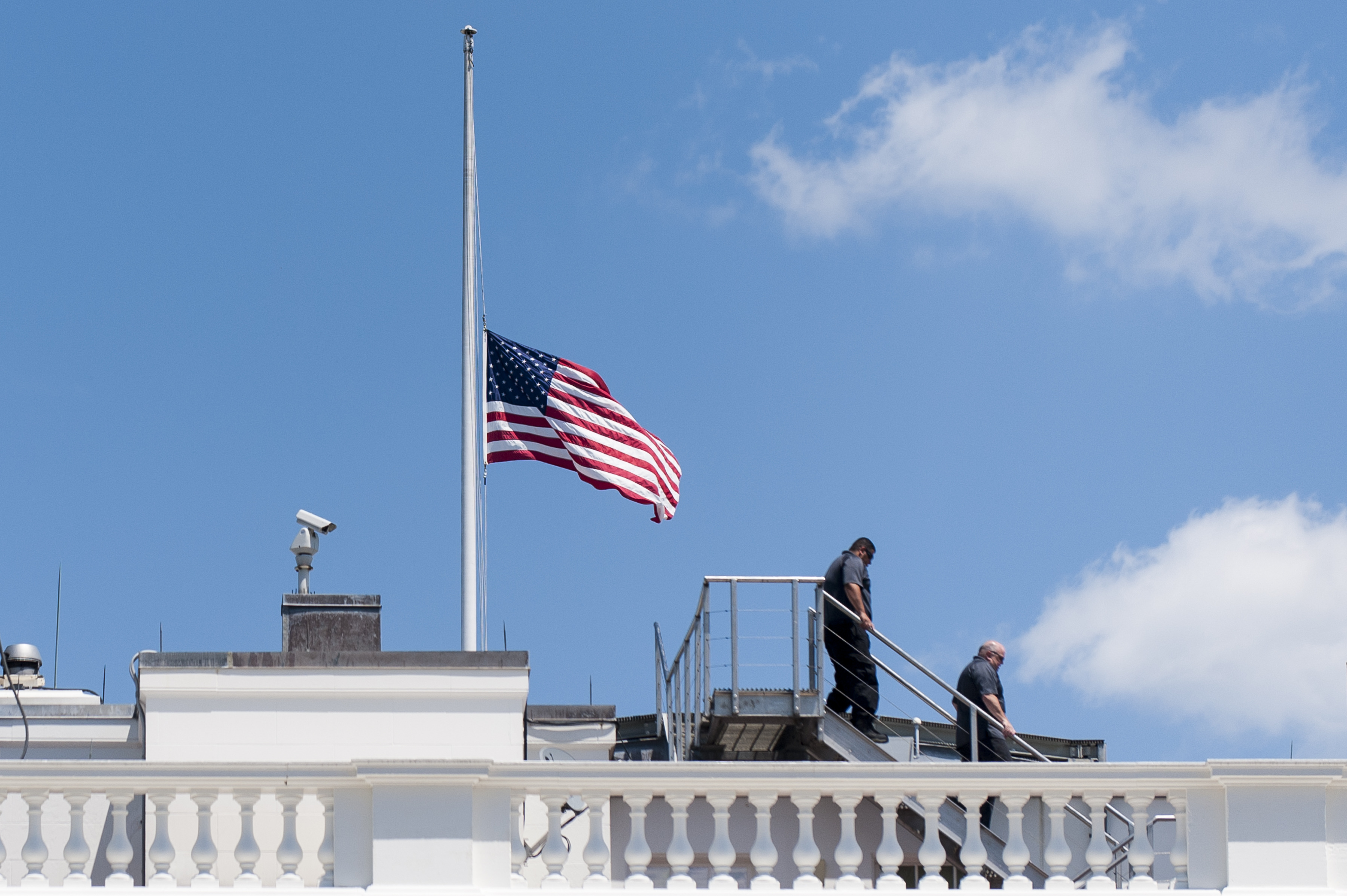 June 12, 2016 - Washington, District of Columbia, United States of America - White House personnel leave the roof after lowering the flag to half staff following United States President Barack Obama's statement in the Brady Press Briefing Room in Washington, District of Columbia, U.S., on Sunday, June 12, 2016, about the deadly shooting the night before in a gay nightclub in Orlando FL. Approximately 50 people were killed and at least 53 more were injured in what appears to be the deadliest mass shooting in U.S. history. .Credit: Pete Marovich / Pool via CNP (Credit Image: © Pete Marovich/CNP via ZUMA Wire)
