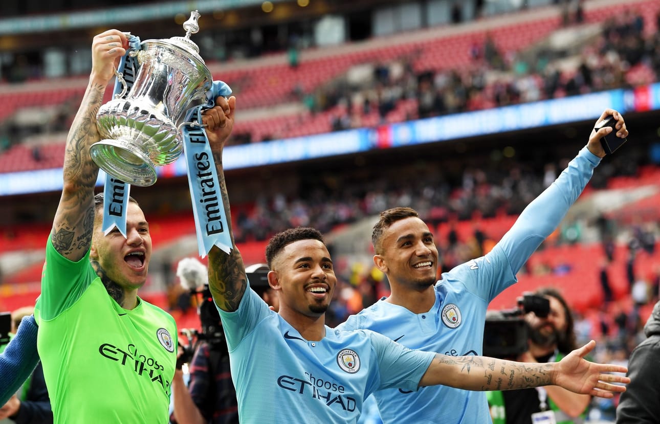 epa07582261 Brazilian players of Manchester City (from left) Ederson, Gabriel Jesus and Danilo celebrate after the English FA Cup final between Manchester City and Watford at Wembley Stadium in London, Britain, 18 May 2019. Manchester City won 6-0. EPA/NEIL HALL EDITORIAL USE ONLY. No use with unauthorized audio, video, data, fixture lists, club/league logos or 'live' services. Online in-match use limited to 120 images, no video emulation. No use in betting, games or single club/league/player publications BY: ALL OVER PRESS / EPA-PHOTO CODE: EPAXX8