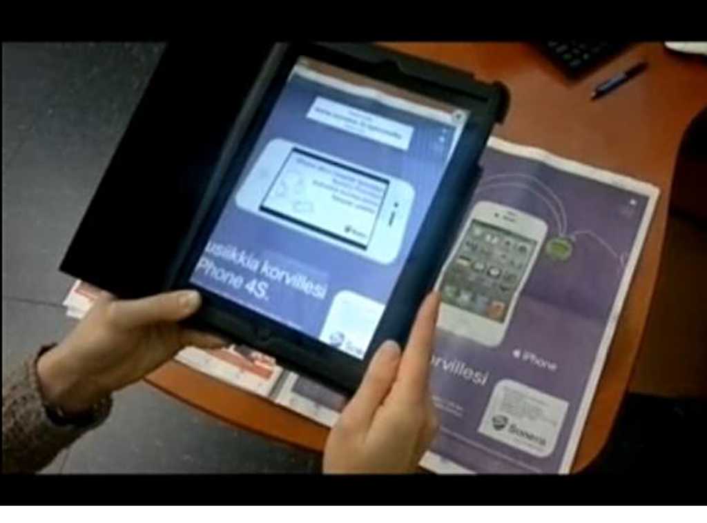 Mainos herää eloon puhelimen tai iPadin näytöllä.