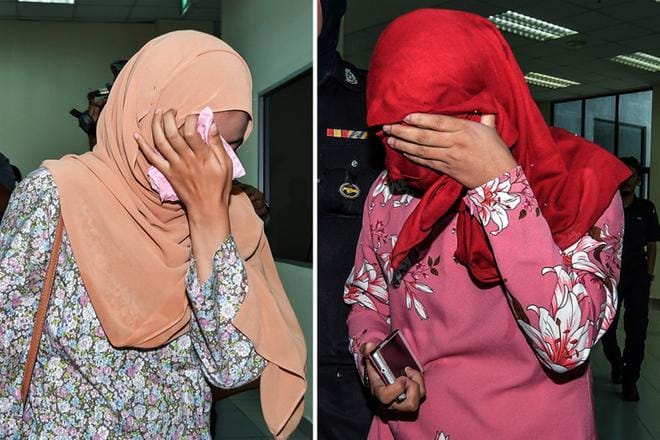Maanantaina Malesiassa ruoskitut 22- ja 32-vuotiaat naiset kuvattiin sen jälkeen, kun sharia-tuomioistuin oli todennut heidät syylliseksi homoseksuaaliseen toimintaan. KUVA: EPA
