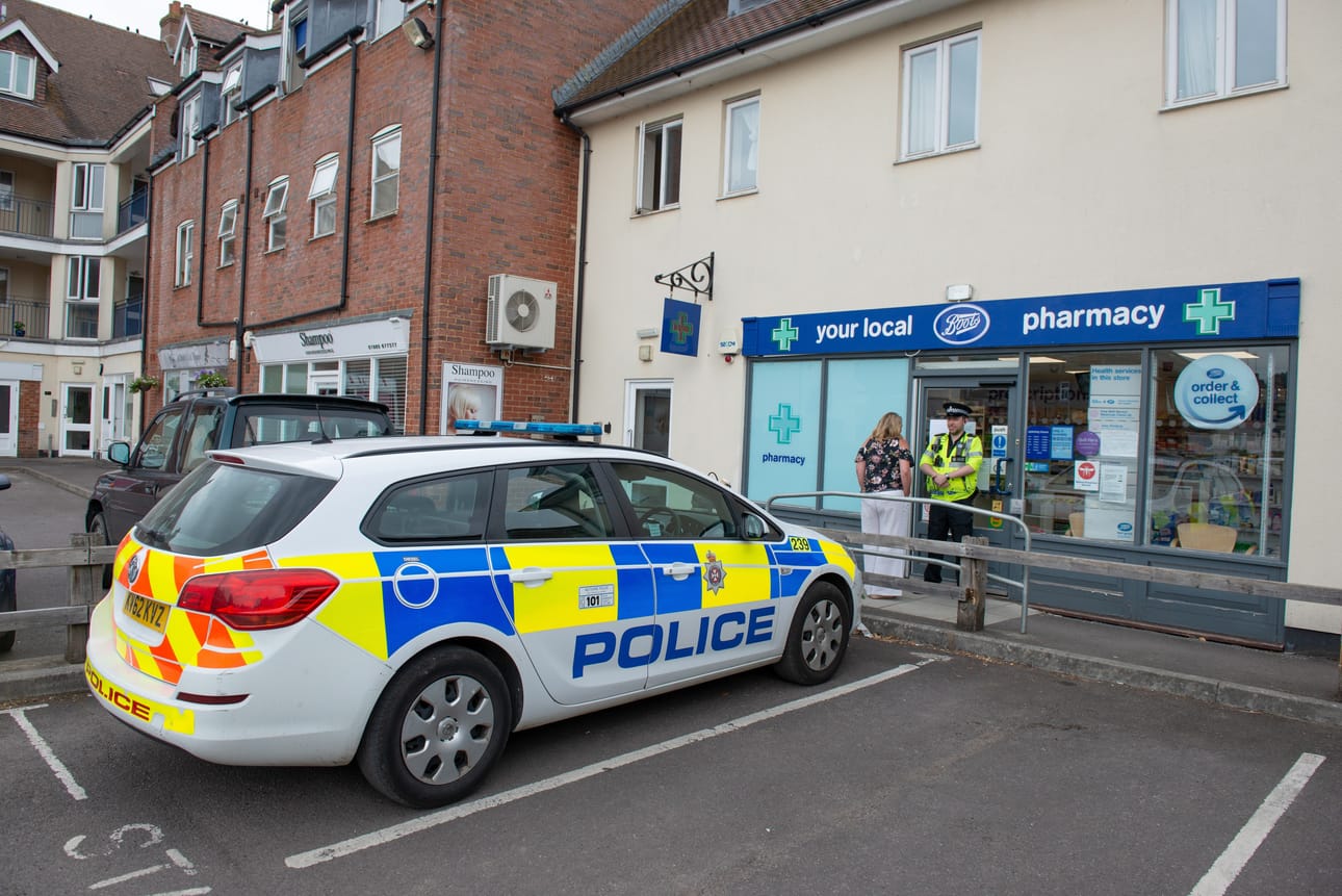 epa06863883 Police outside of the Boots Pharmacy, which has been closed in relation to two people who were found unconscious following exposure to an unknown substance, in Amesbury, Wiltshire, Britain, 04 July 2018. According to Wiltshire Police, they investigate the case of a man and a woman, both in their 40s, who are in a critical condition at Salisbury District Hospital. EPA/TONY KERSHAW / SWNS UK OUT BY: ALL OVER PRESS / EPA-PHOTO CODE: EPAXX8