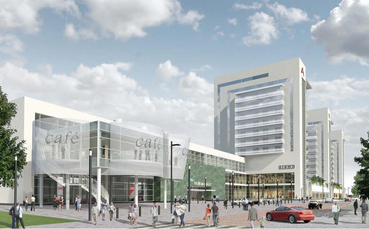 Matkakeskus etualalla ja taustalla kolme Rautatienkadun varteen tulevaa asuintornia.